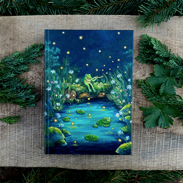 Carnet peint à la main, un décor nocturne avec une grenouille qui joue de la musique au bord de l'eau.